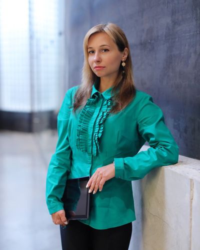Confident businesswoman with analytical expertise in modern office setting